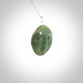 Hand made New Zealand Jade moon face necklace with Sterling Silver. Made by NZ Pacific and sale online only. Delivered with sterling silver chain and packaged in a woven kete pouch.